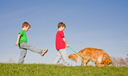 kids walking dog